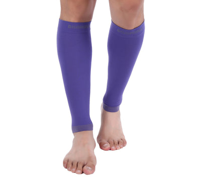 A woman wearing Violet Calf Compression Sleeve 20-30 mmHg for fast recovery and circulation.