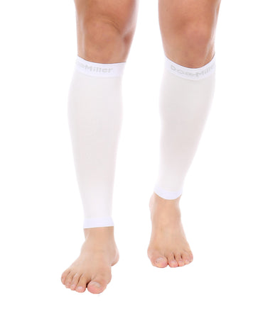 A man wearing Calf Compression Sleeve 20-30 mmHg WHITE.